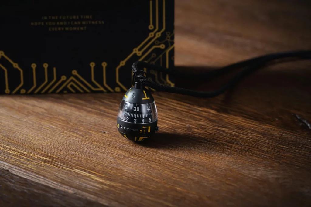 Black and yellow egg timer on a wooden surface illustrating 2 minute rule atomic habits for beating procrastination