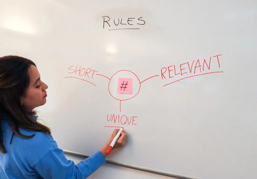 Woman writing on a whiteboard with active recall studying examples checklist and common mistakes to avoid