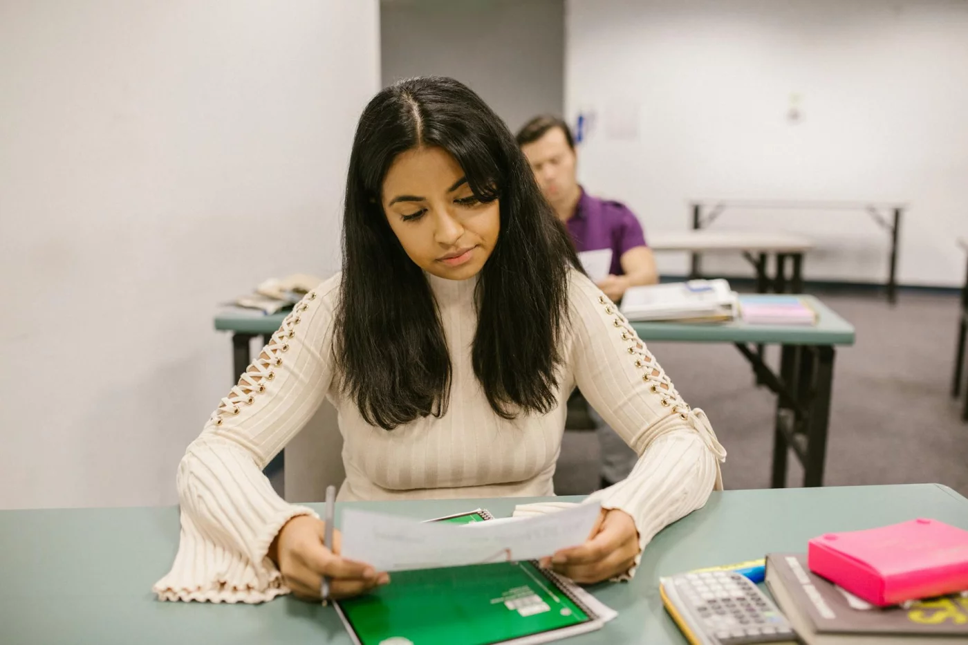 College student reviewing exam results and reflecting on active recall studying examples for better flashcards
