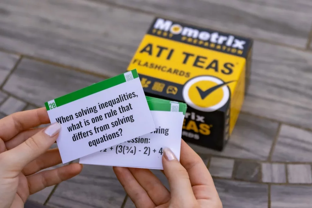 Person holding a white, green, and yellow box illustrating active recall vs passive review study methods