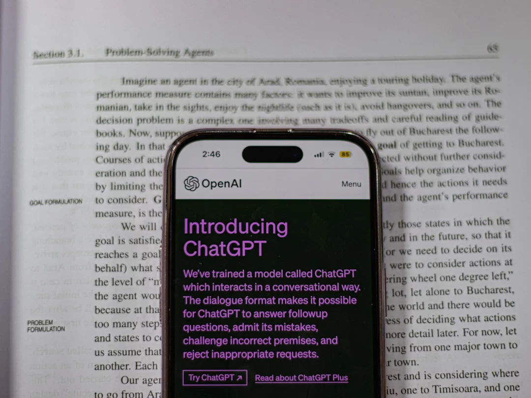 Cell phone on an open book illustrating an active recall website and app tools for efficient study workflows