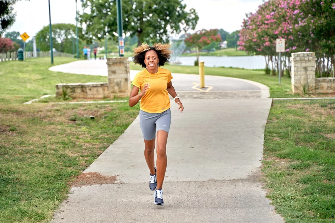 Exercise and Memory: 7 Proven Ways to Use Movement Better Woman running on a park sidewalk during a 7-day aerobic exercise for memory plan