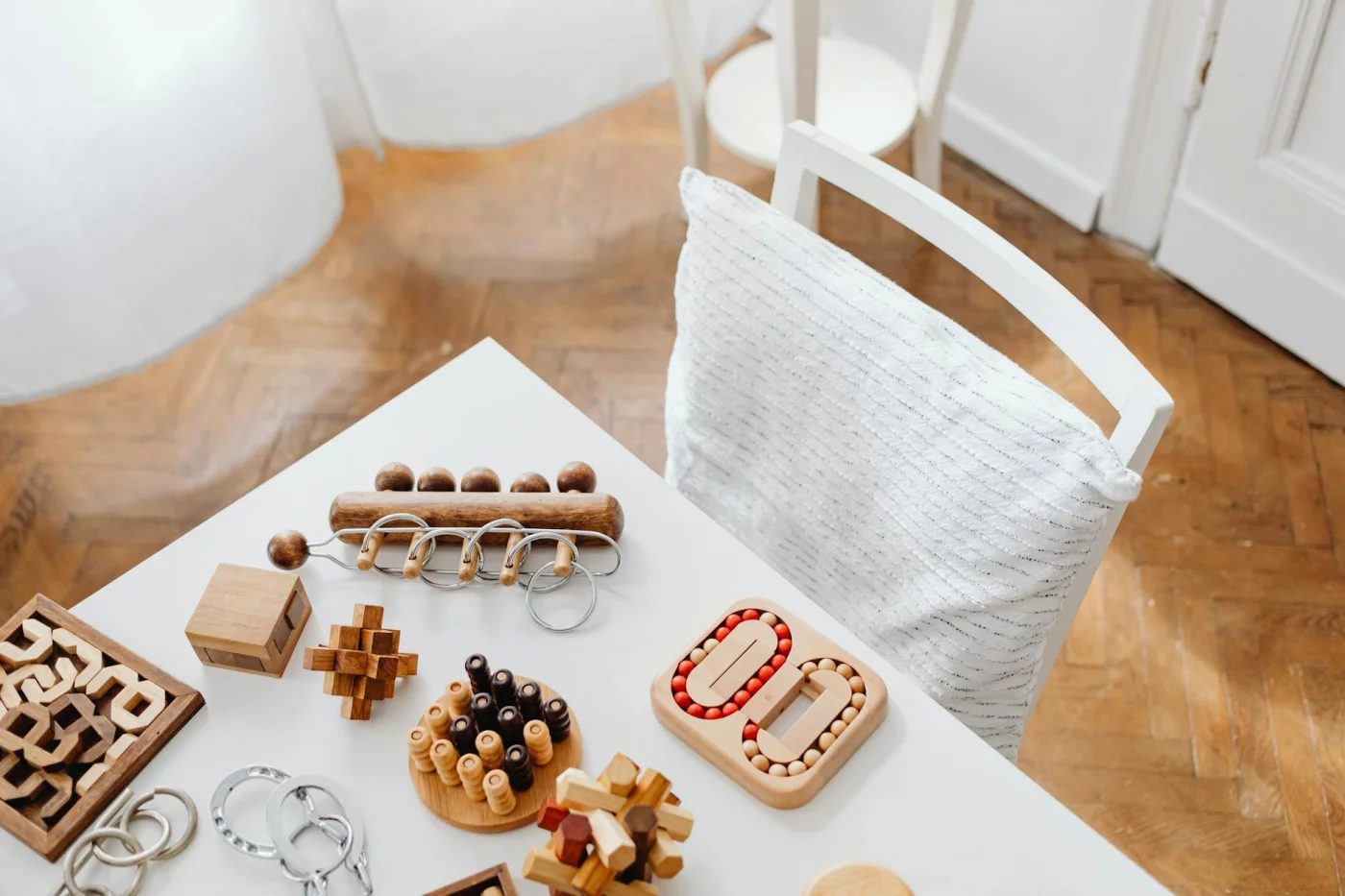 Do Brain Training Games Work for Adults? Wooden puzzle toys on a table illustrating best brain games for adults and a 5-step plan for better-supported habits