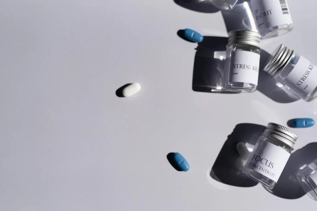 Best Supplements for High Cortisol: Evidence and Cautions Medicine bottles and pills on white background illustrating best supplements for high cortisol and brain fog
