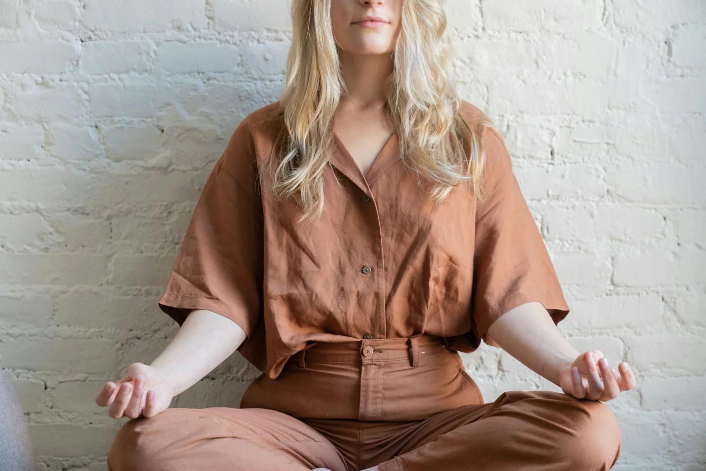 Body Scan Meditation for Sleep: 4 Step-by-Step Scripts and the Science Woman practicing body scan meditation for sleep indoors, following a step-by-step mindfulness relaxation routine