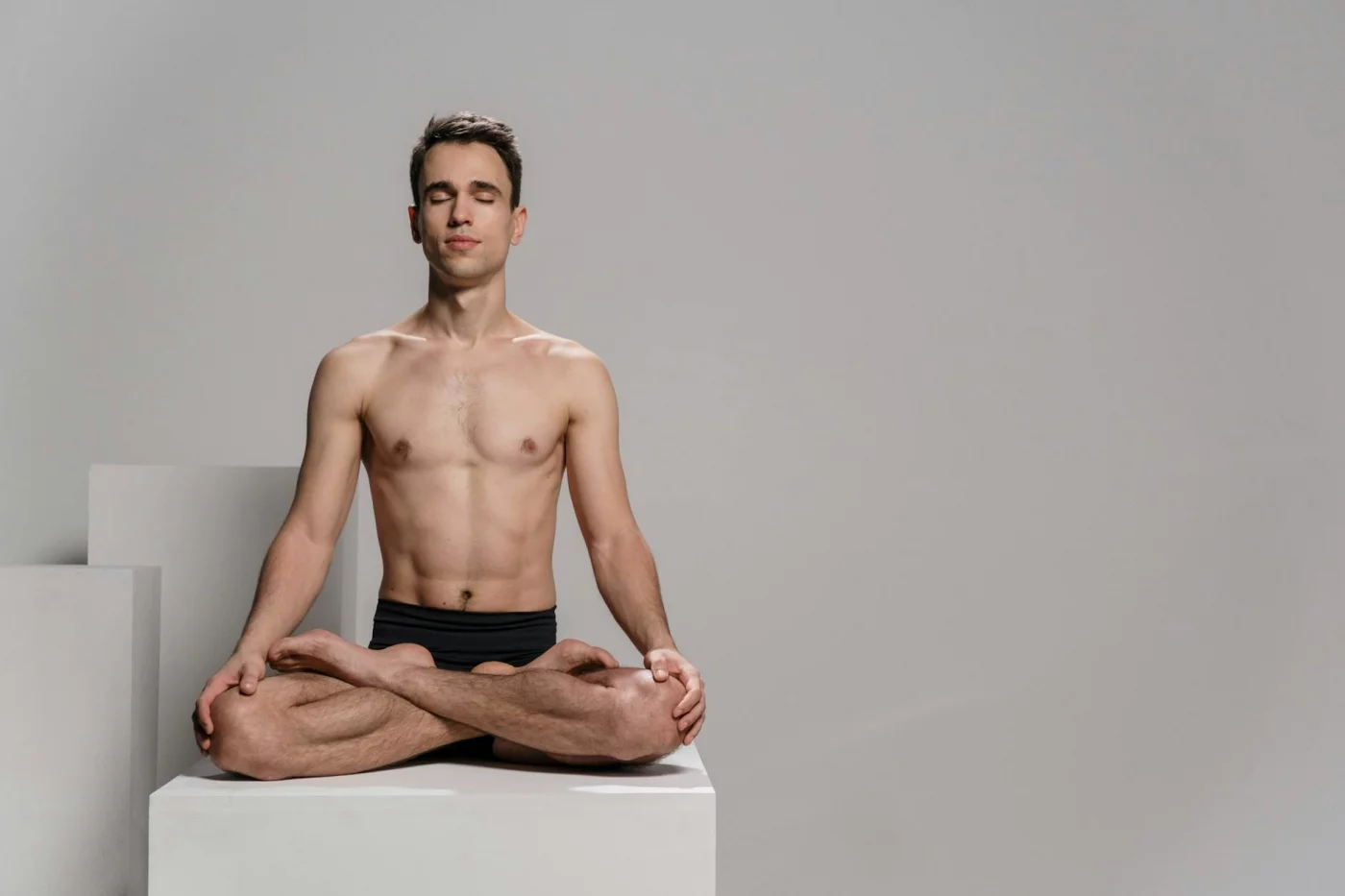 Body Scan Meditation for Sleep: 4 Step-by-Step Scripts and the Science Man meditating in lotus pose beside quick tips for body scan meditation for sleep, including ideal length and habit cues