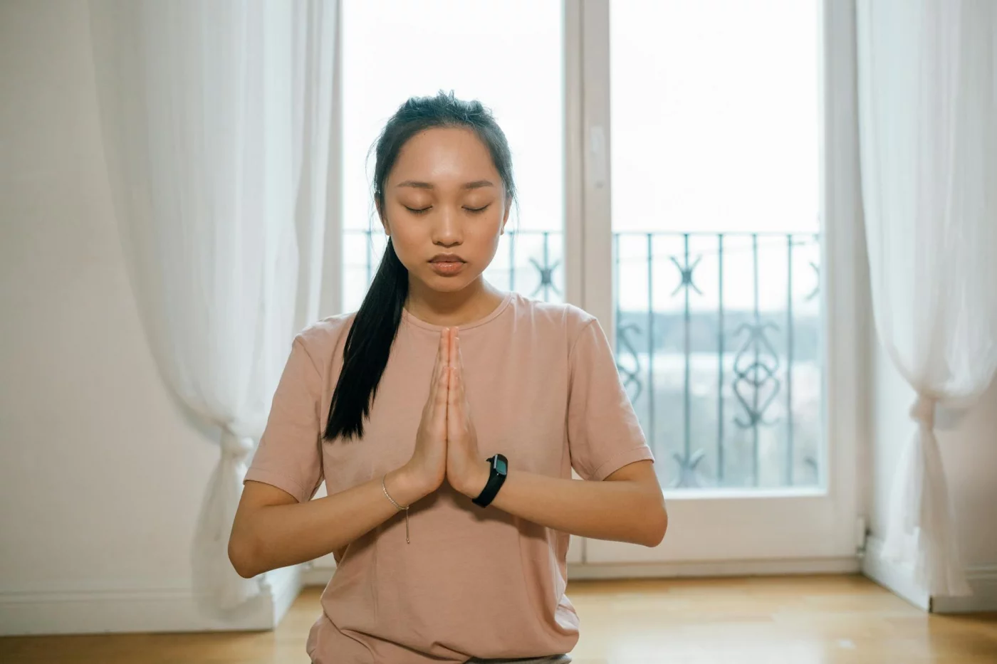 Woman meditating indoors while choosing breathing exercises for stress based on how she feels