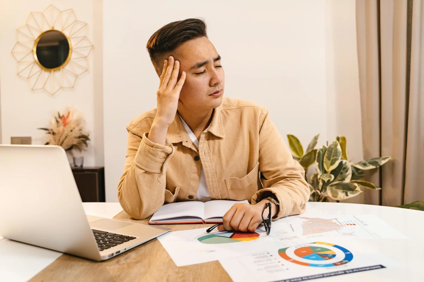 Businessman overwhelmed at home office, illustrating can high cortisol cause brain fog and stress-related memory loss