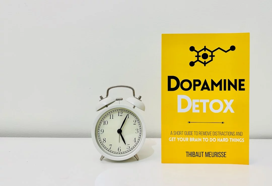 Dopamine, anticipation, and motivation: 7 neuroscience-backed insights Clock and book illustrating dopamine anticipation of reward in the brain’s reward system, pathways, and common myths