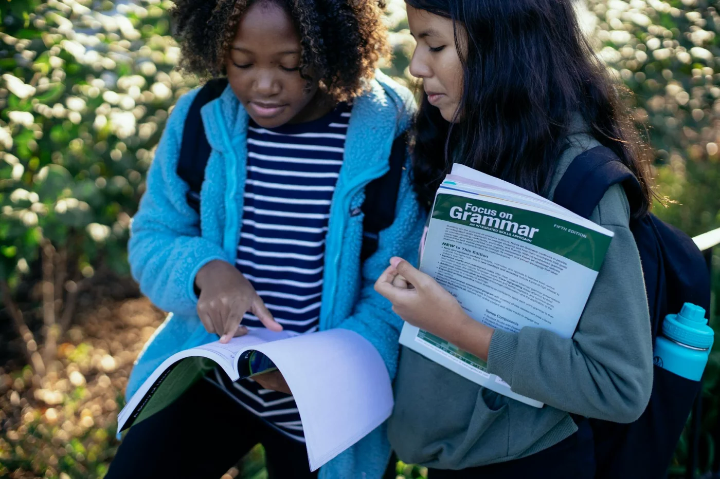Schoolchildren studying together in sunlight, exercises to improve memory and concentration for students