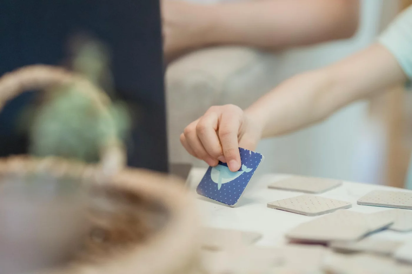 Child playing a memory card game showing exercises to improve memory and concentration for students