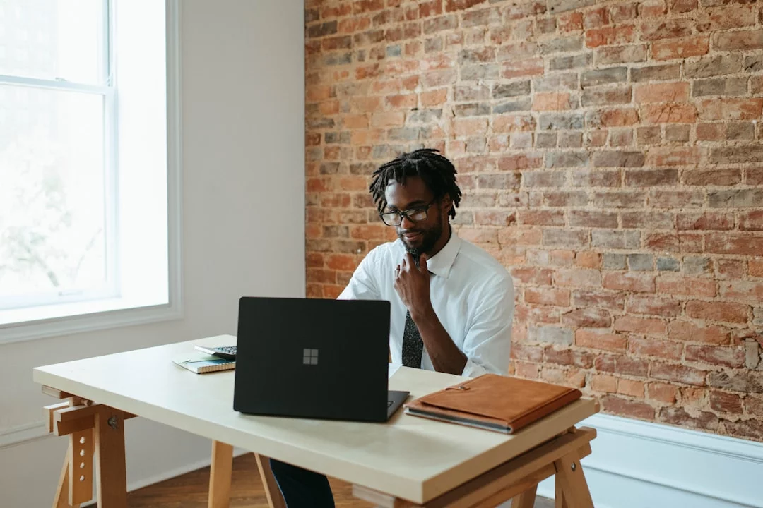 How AI Increases Productivity for Knowledge Workers Researcher reviewing what studies show on how does ai increase productivity while working at a laptop