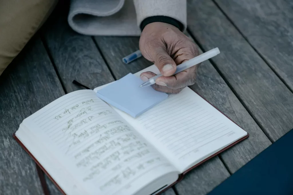 Journal writing scene illustrating how to improve brain function and memory with focused daily note-taking