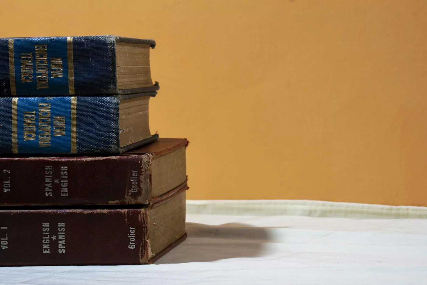 How to Learn Spanish in 6 Months: A Realistic Plan Vintage English-Spanish dictionaries for tracking how to learn spanish in 6 months and plan next steps
