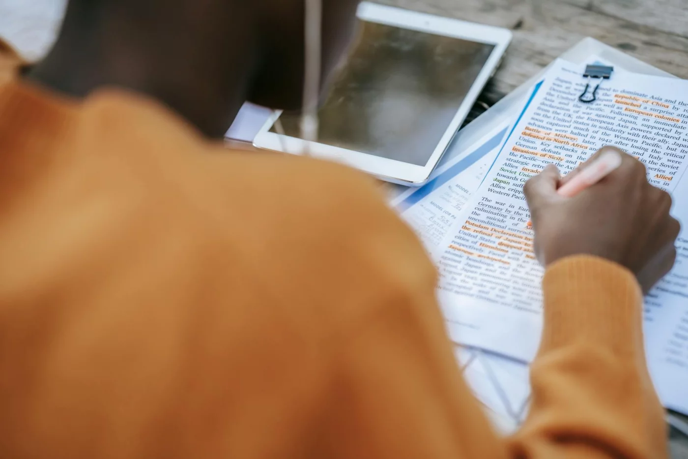 How to Take Notes From a Textbook Fast: 5 Methods That Actually Save Time Student using a tablet and notebook to learn how to take notes from textbook fast for college courses