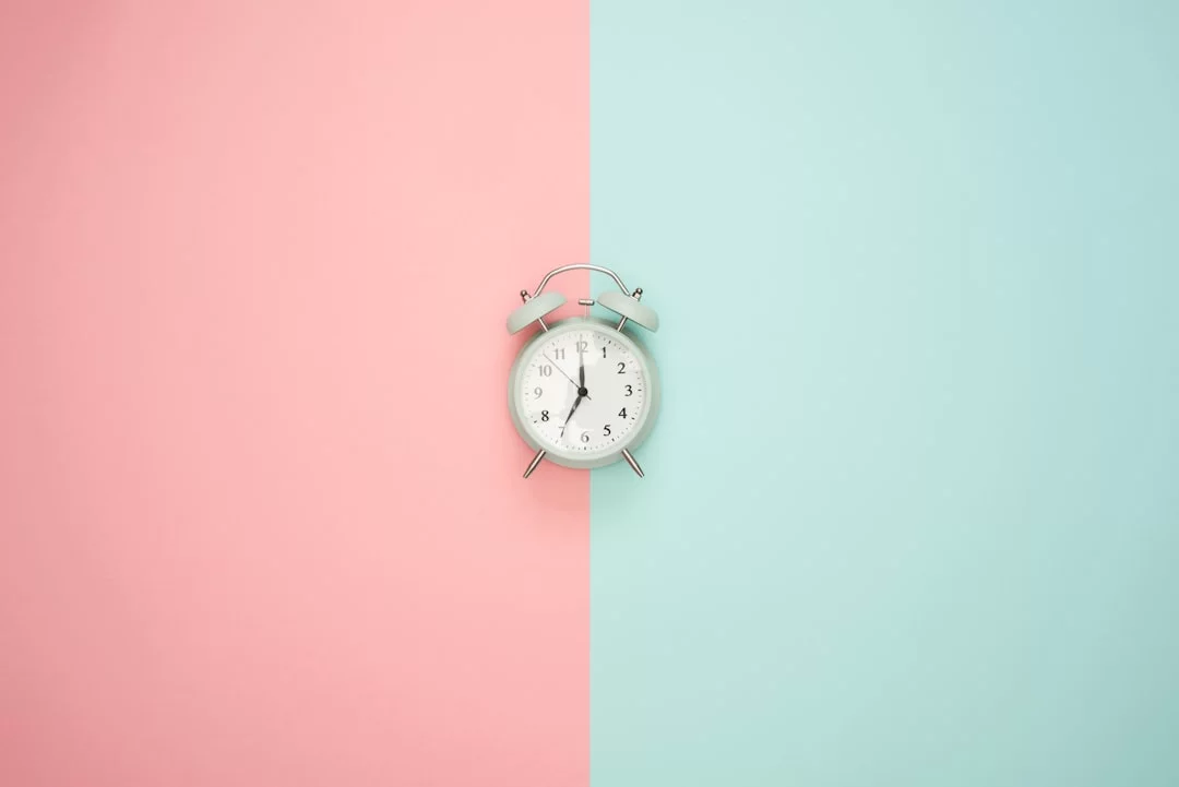 Silver bell alarm clock illustrating how to use the 2 minute rule to start small actions and build momentum