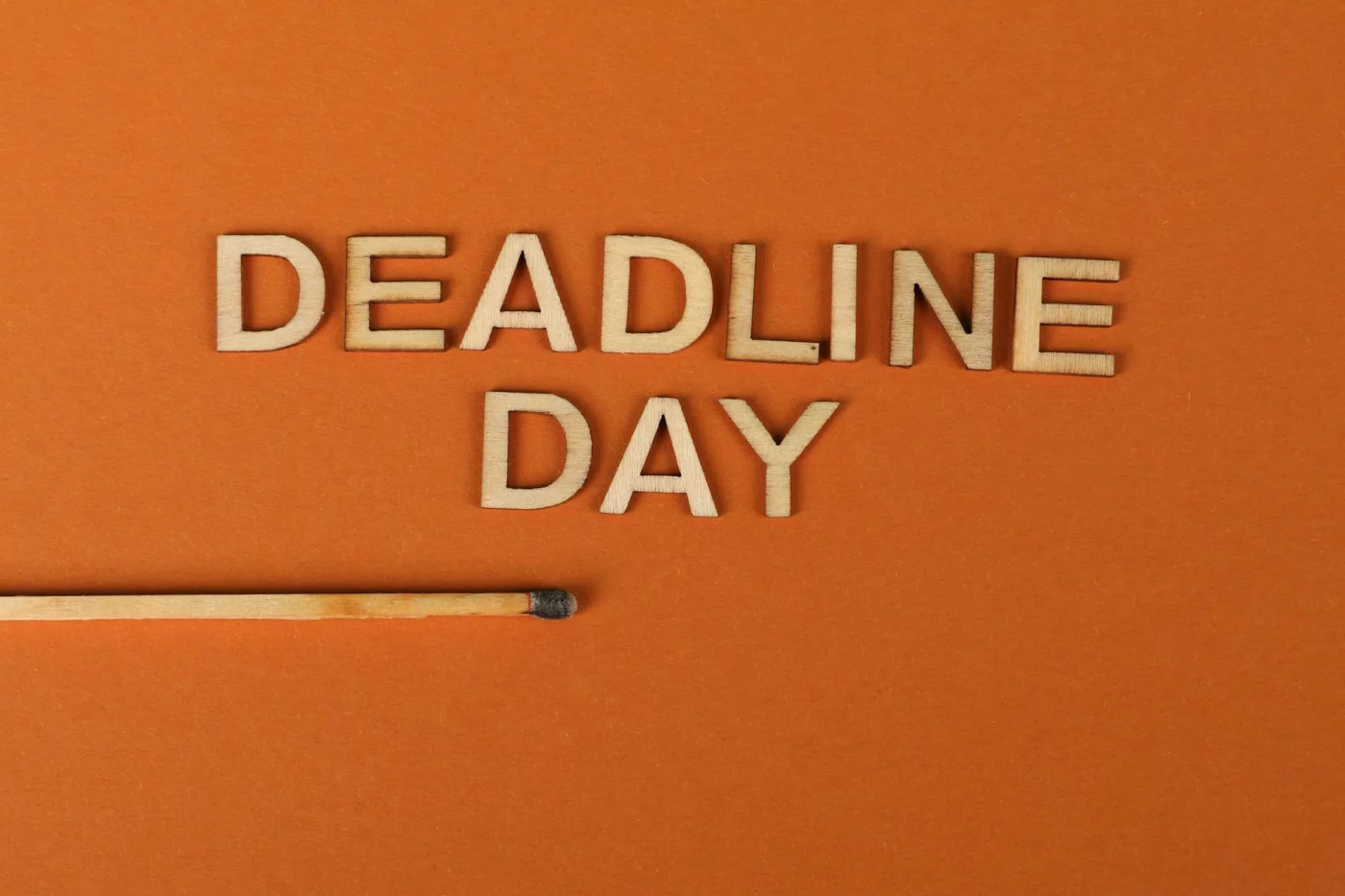 How to Set Deadlines That Actually Work (Without Burnout) Deadline design framework showing importance of meeting deadlines at work with wooden letters and burnt matchstick
