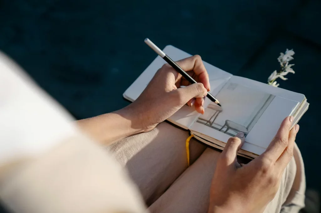 Method of Loci: 7 Simple Steps to Build a Memory Palace Designer sketching a room layout in a journal, illustrating memory palace examples for visual learning