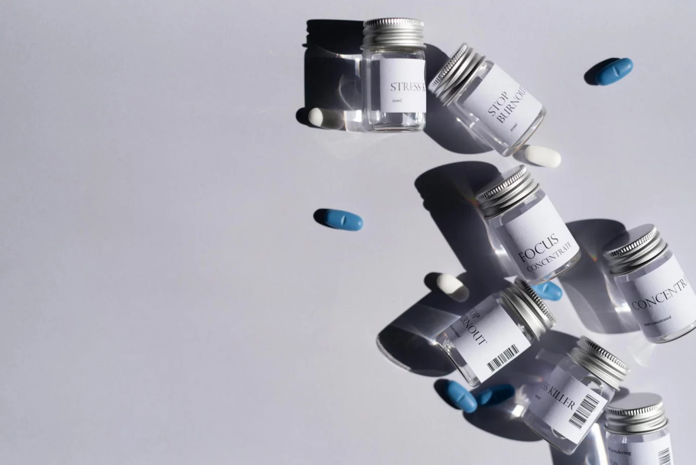Assorted pills and labeled bottles illustrating nootropics side effects and safety concerns for students