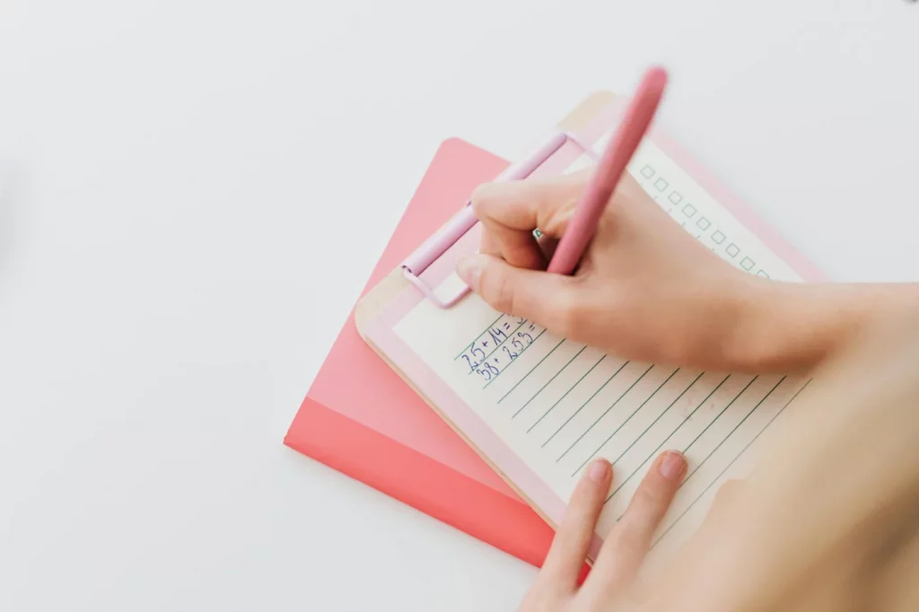 Person solving math equations on a pink clipboard, illustrating pi world record human facts for 2025