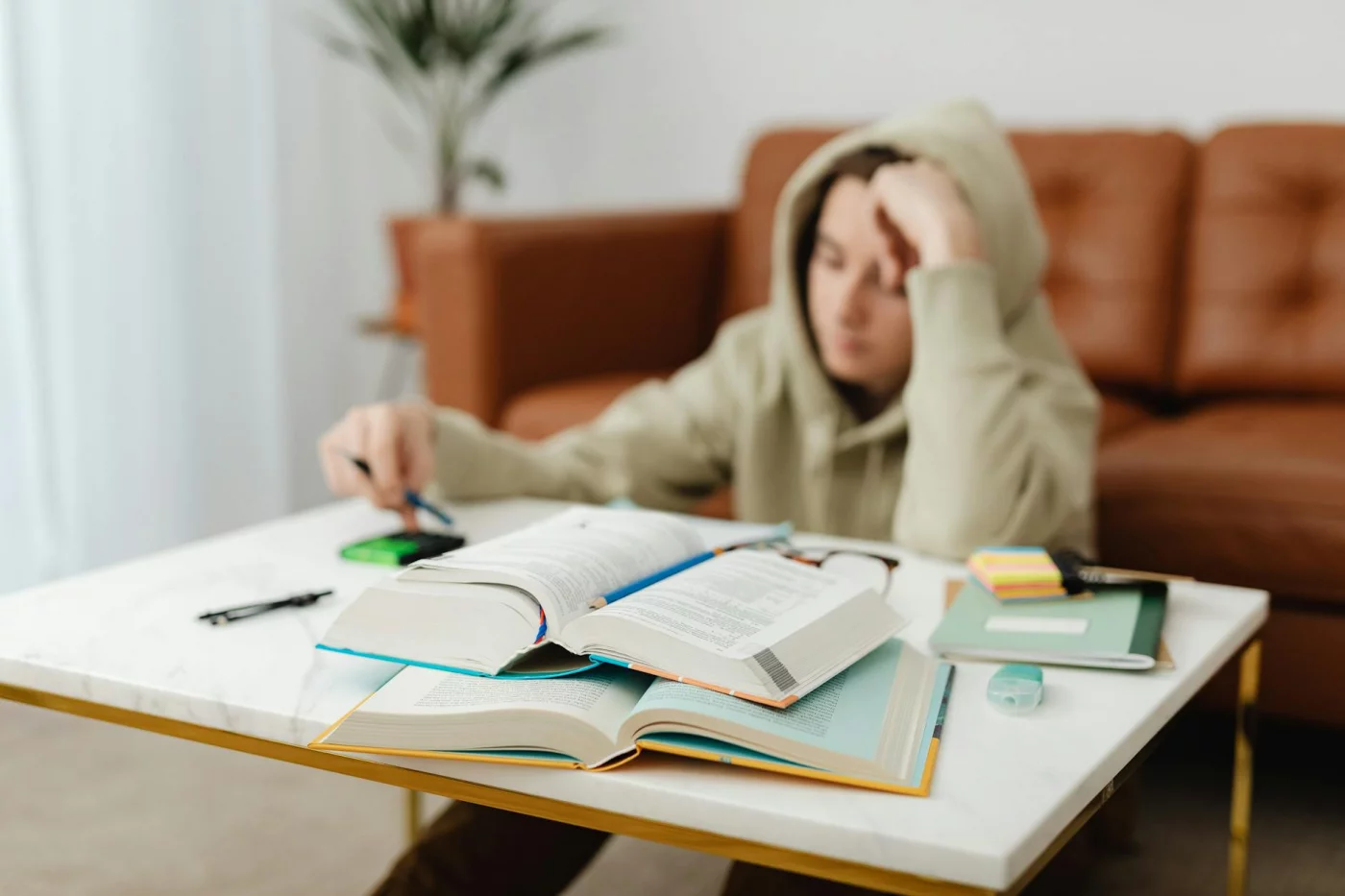 Science-Backed Study Methods: What Actually Works Teenager studying with books and notes, using scientifically proven study methods to learn faster