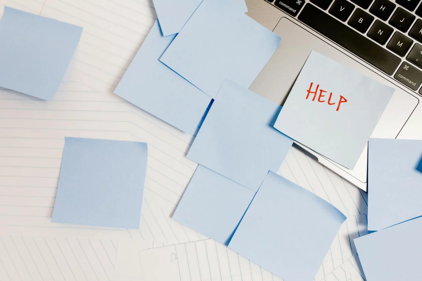 Best Second Brain Apps and Note-Taking Systems Compared Cluttered laptop workspace with sticky notes showing common second brain apps reddit mistakes and the best app choice