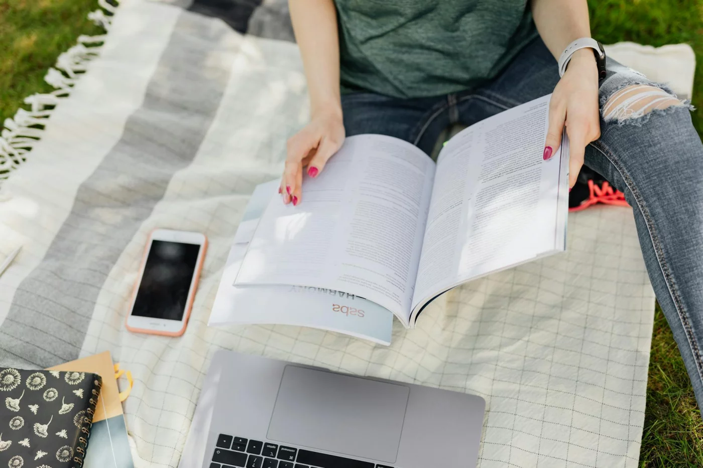 What Is Digital Minimalism for Students? 7 Phone Rules That Actually Work Student studying outdoors with a laptop and phone, showing what is digital minimalism in daily campus life