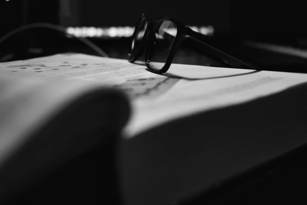 Active Recall for Medical School: A Practical Study Workflow what is active recall for med school? Glasses resting on a study book for effective exam prep