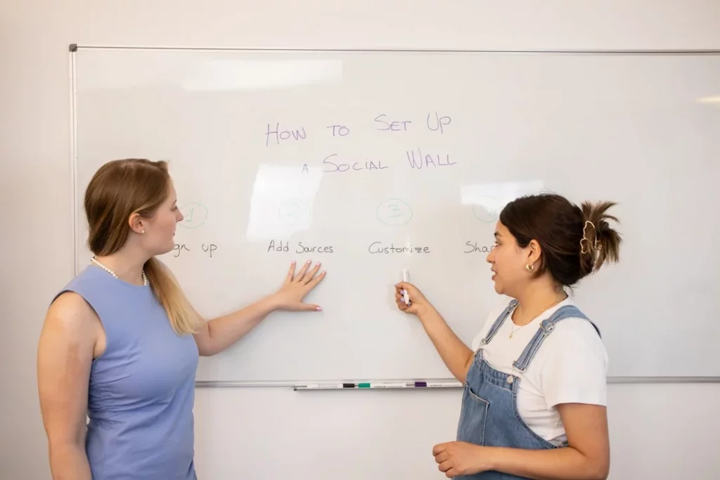 What Is Immersion Language Learning and How Can You Use It at Home? Two women at a whiteboard discussing what is immersion language learning and practical study tips