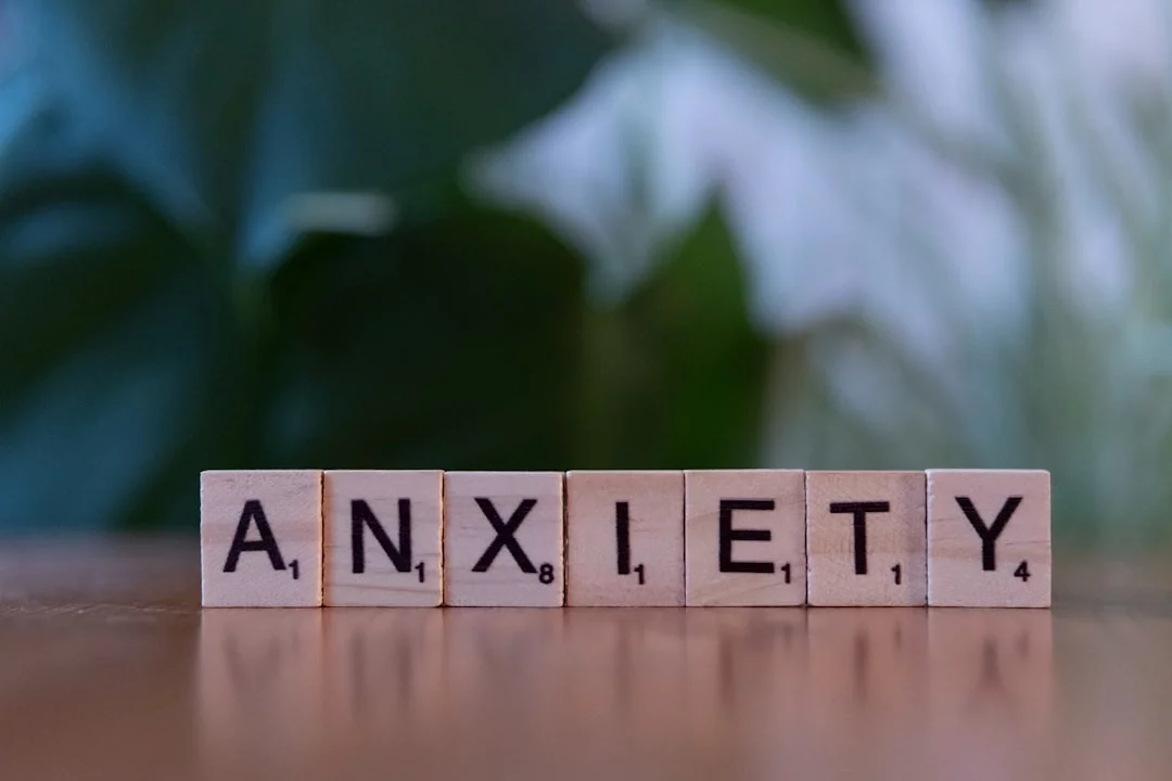 How to Calm Test Anxiety Before an Exam Wooden blocks spelling anxiety on a table, illustrating what is the 3 3 3 rule for anxiety before exams