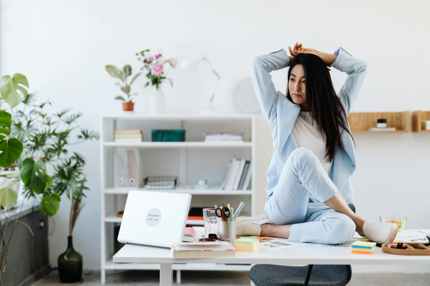 Progressive Muscle Relaxation Script for Fast Stress Relief Businesswoman relaxing at her desk in a stylish office, illustrating a 5 minute progressive muscle relaxation script