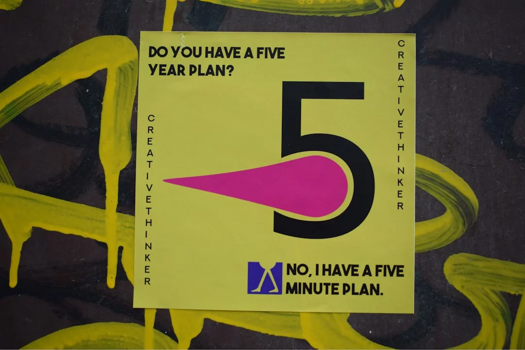 Yellow and black book on green and yellow textile illustrating the 5-minute rule for procrastination