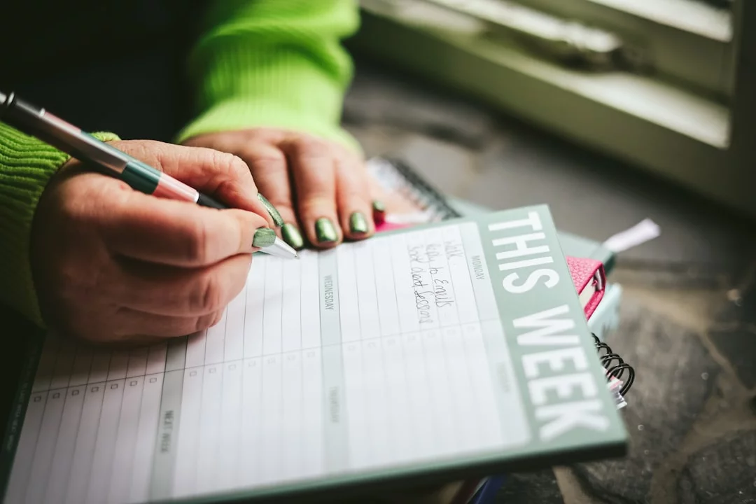 6-Month MCAT Study Schedule: A Realistic 24-Week Plan Student adjusting a 6 month mcat study schedule while writing notes on paper for pacing and timing decisions