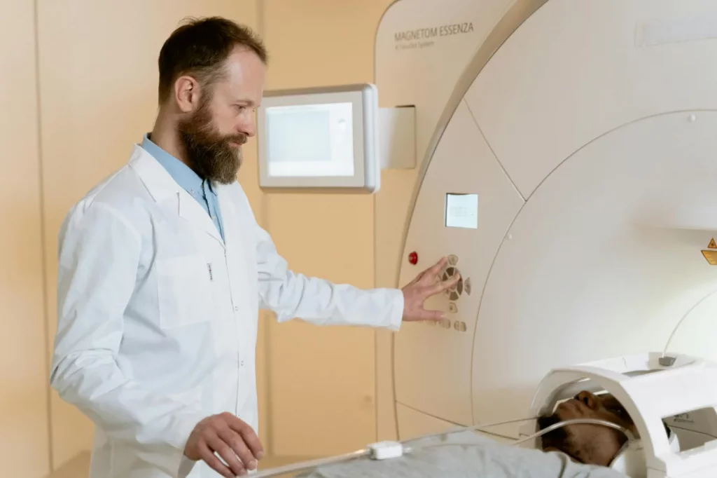 Doctor operating an MRI scanner during a brain scan, exploring do we use only 10 percent of our brain