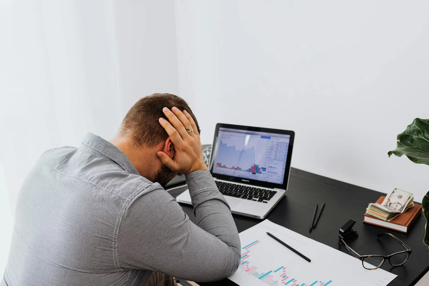 Does Stress Affect Memory Recall? A Practical 7-Step Guide Businessman at desk with laptop and charts, illustrating FAQs on does stress affect memory recall