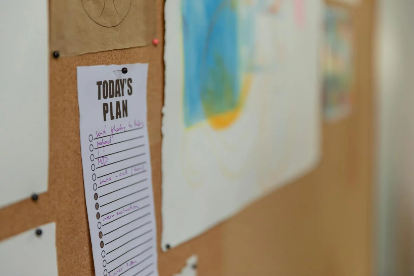 Executive Dysfunction vs Procrastination: 7 Proven Ways to Start Tasks Corkboard with a to-do list and colorful artwork illustrating executive dysfunction vs procrastination in the workplace