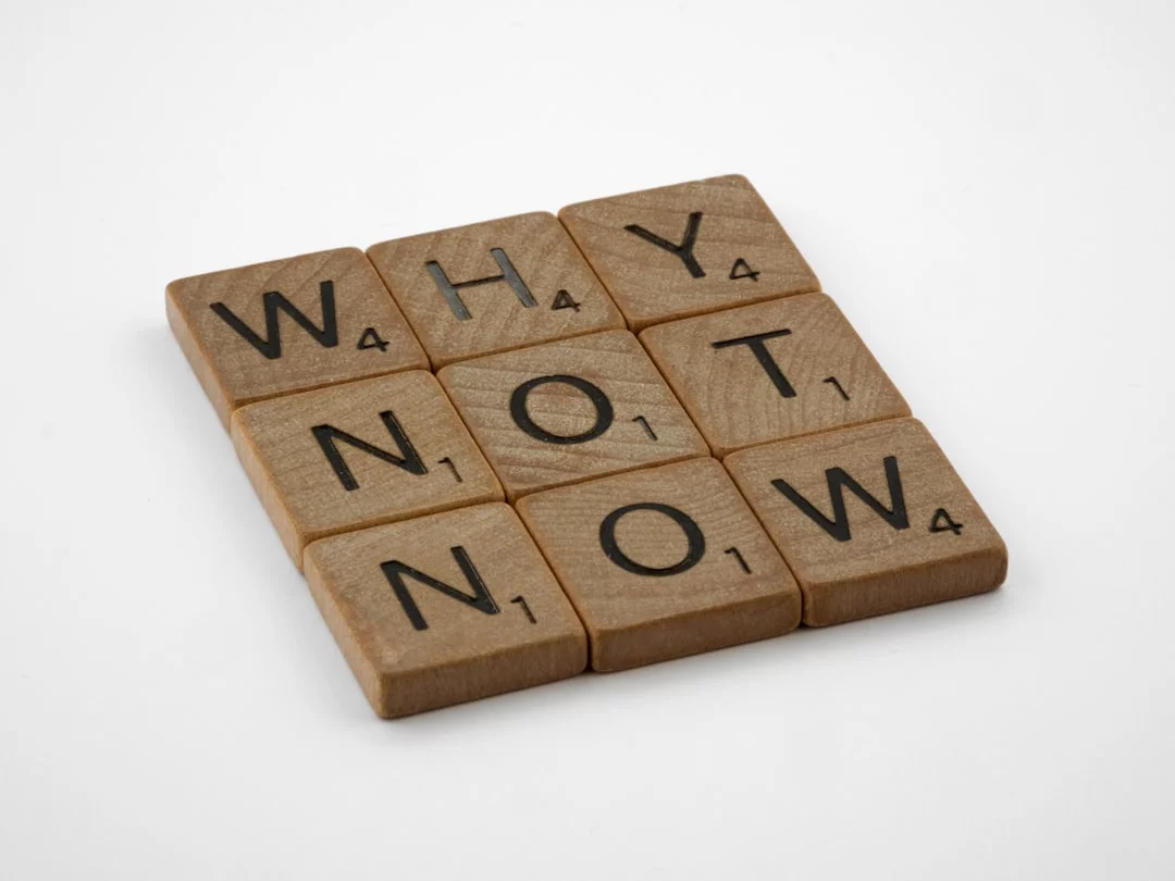 Executive Dysfunction vs Procrastination: 7 Proven Ways to Start Tasks Wooden blocks reading "why not now" illustrating executive dysfunction vs procrastination