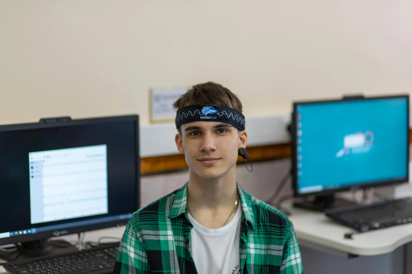 How Brain Waves Are Measured and Which Method Fits Best Young man wearing a Neuroplay EEG headband in a lab, showing how are brain waves measured with modern tools