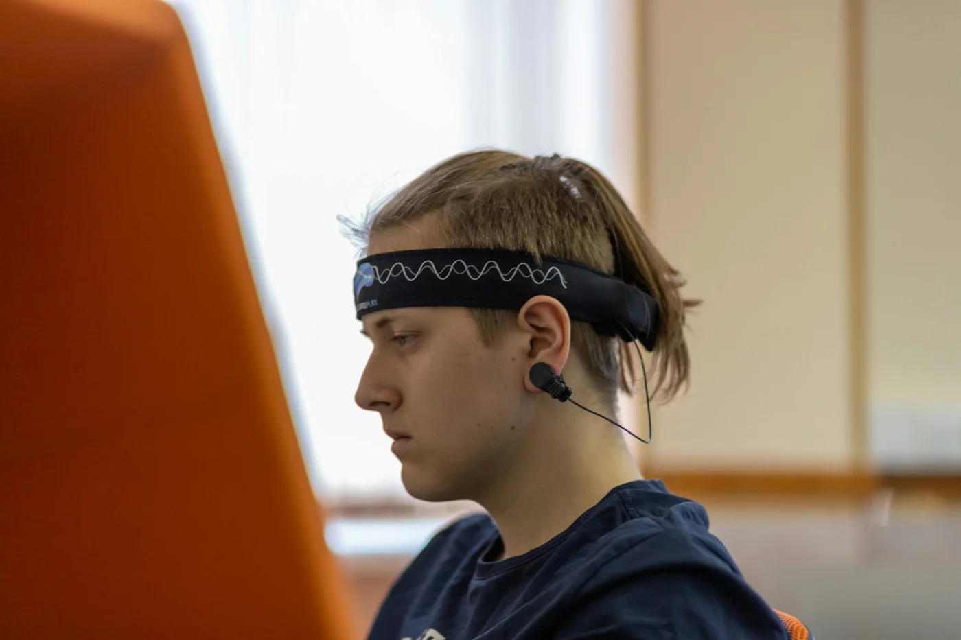 How Brain Waves Are Measured and Which Method Fits Best Quick reference on how are brain waves measured, shown with a focused adult wearing a headband and earbuds