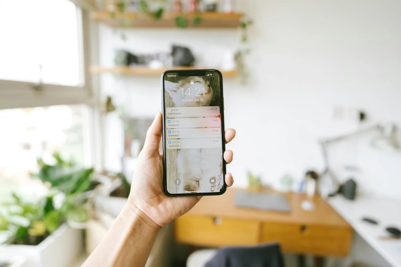 Smartphone with work notifications in an office, reflecting how long does it take to decompress after work