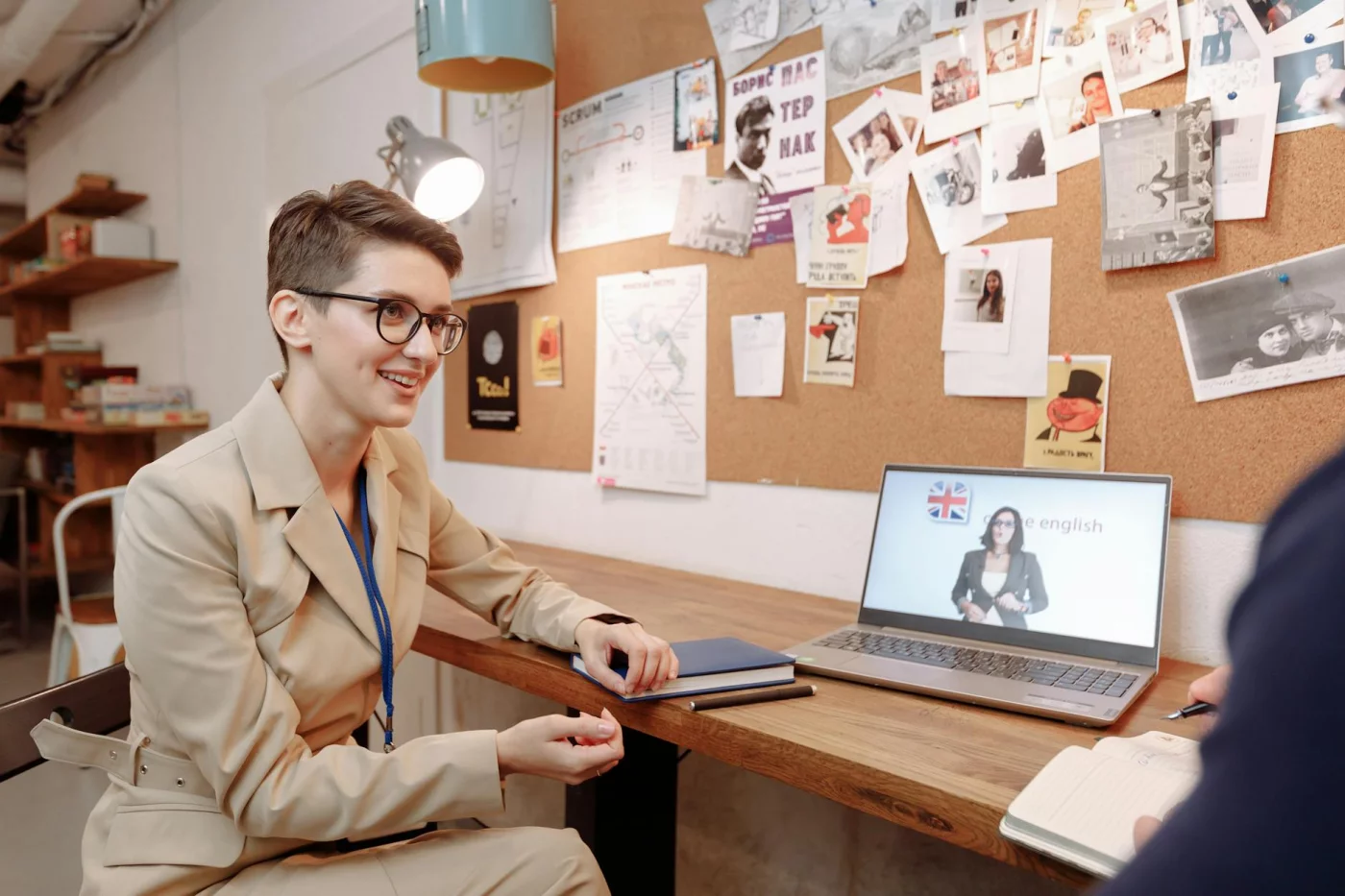 How Long Does It Take to Learn a Language? 7 Realistic Timelines by Level Woman in an online English class illustrating what fluency means and how long does it take to learn a language fluently
