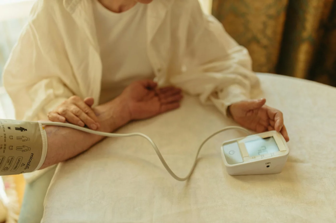 How to Prevent Alzheimer’s and Dementia: What Actually Helps Senior adult checking blood pressure at home, a heart-healthy habit for how to prevent alzheimer's and dementia