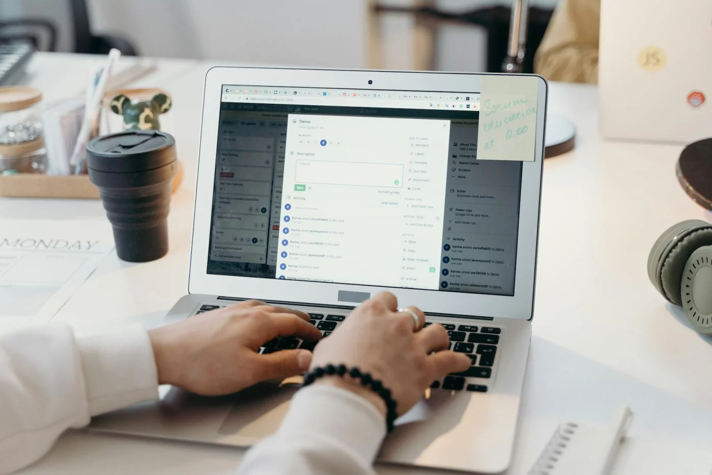 How to Stop Checking Email Every 5 Minutes With Email Batching Person typing on a laptop while setting device boundaries, showing how to stop obsessively checking email