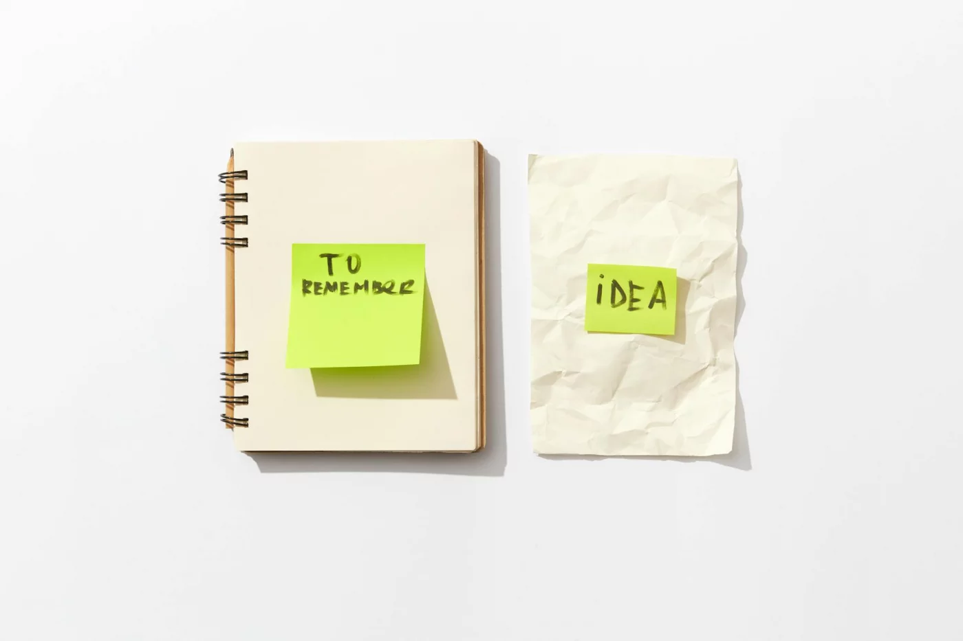 How to Take Notes from Video Lectures With 4 Smart Methods Notebook and sticky notes showing how to take notes from video lectures using transcripts, AI, and device tools