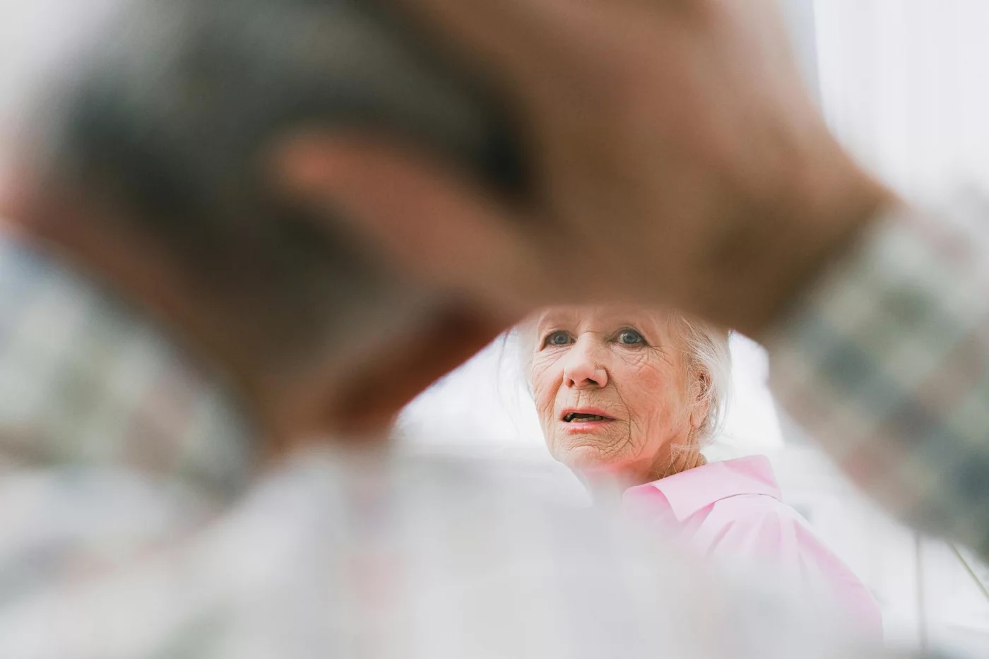 How to Talk to a Parent About Their Memory Loss Without Causing Panic Contemplative older woman illustrating how to talk to a parent about their memory loss and respond to denial