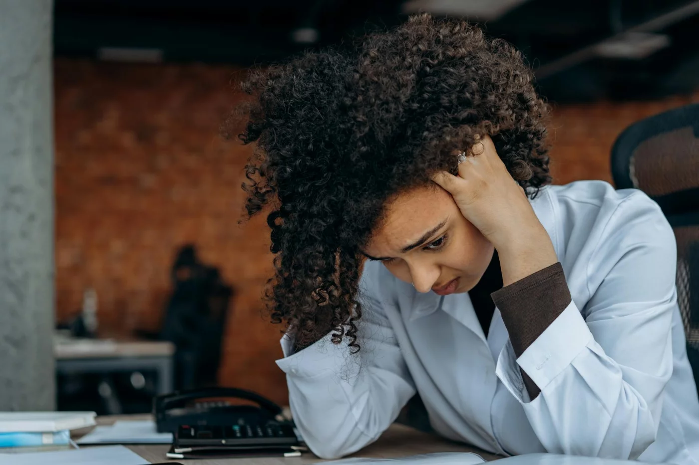 Is Memory Loss From Stress Reversible? What Stress Really Does to Memory Stressed office worker reviewing documents, asking is memory loss from stress reversible during recovery