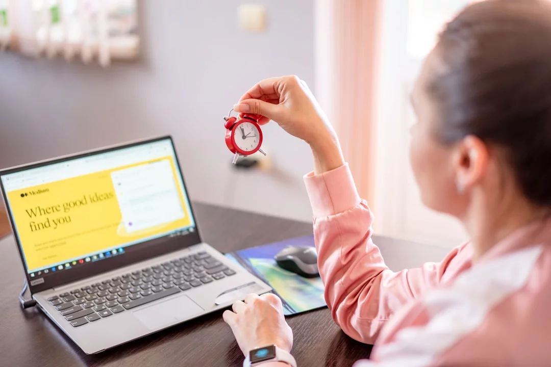 Pomodoro Technique for ADHD: 7 Smart Tweaks That Actually Help Woman at a desk with a laptop researching whether is pomodoro technique effective for studying with ADHD