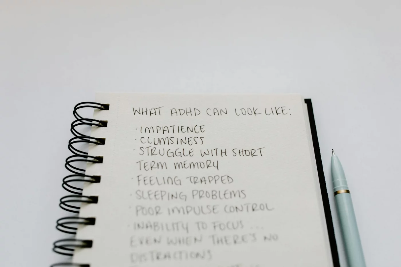 What Is Long-Term Memory in Psychology? 7 Clear Ways to Understand It Notebook listing ADHD symptoms, illustrating the long term memory definition in psychology and focus challenges