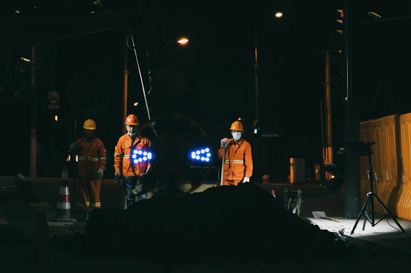 How to Build a Habit System That Actually Works on Rotating Shifts Night roadworks crew in reflective gear under bright lights, illustrating rotating shift examples in action