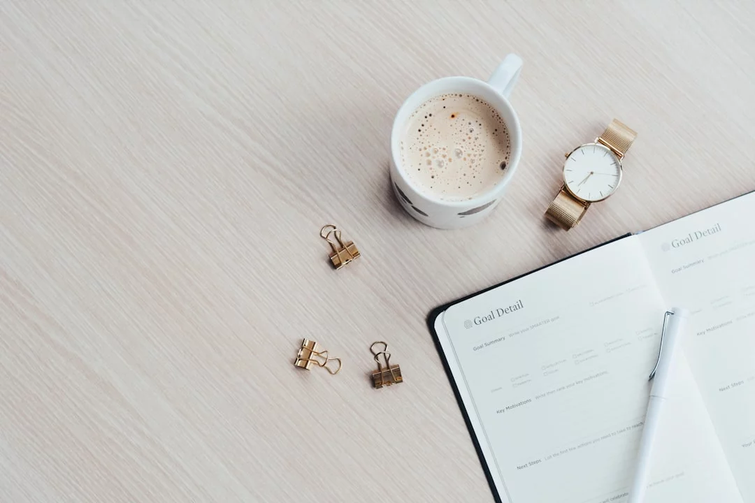 Brain-Friendly Morning Routines That Boost Focus Without 5 a.m. Wakeups White printer paper beside a filled mug for planning a scientifically proven best morning routine